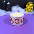 Vela aromática Halloween em pote de cerâmica Boo Laranja – Casa da Bruxa